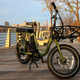 A photo of the RadRunner 2 electric bike at sunset.